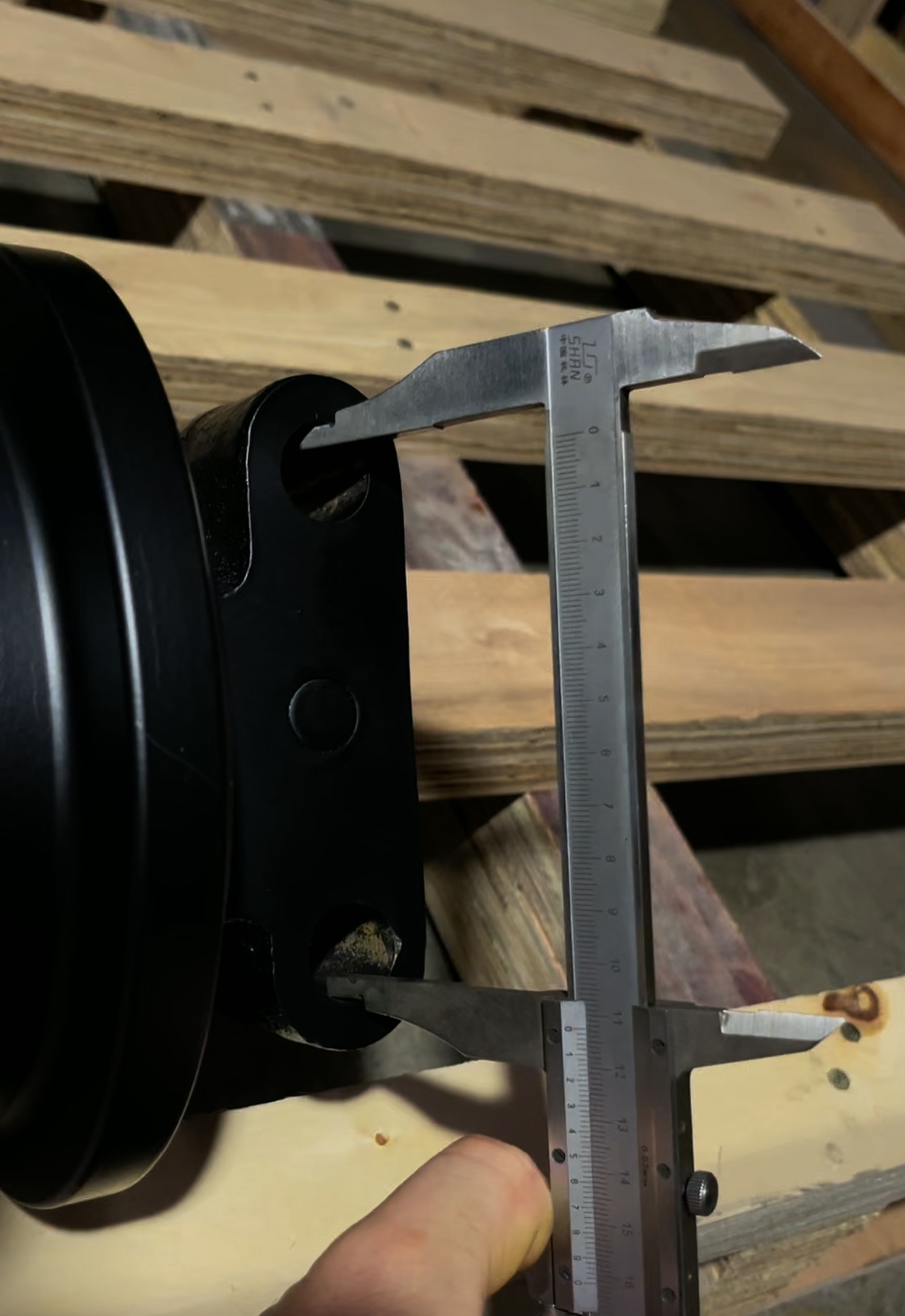 Track roller mounting hole spacing